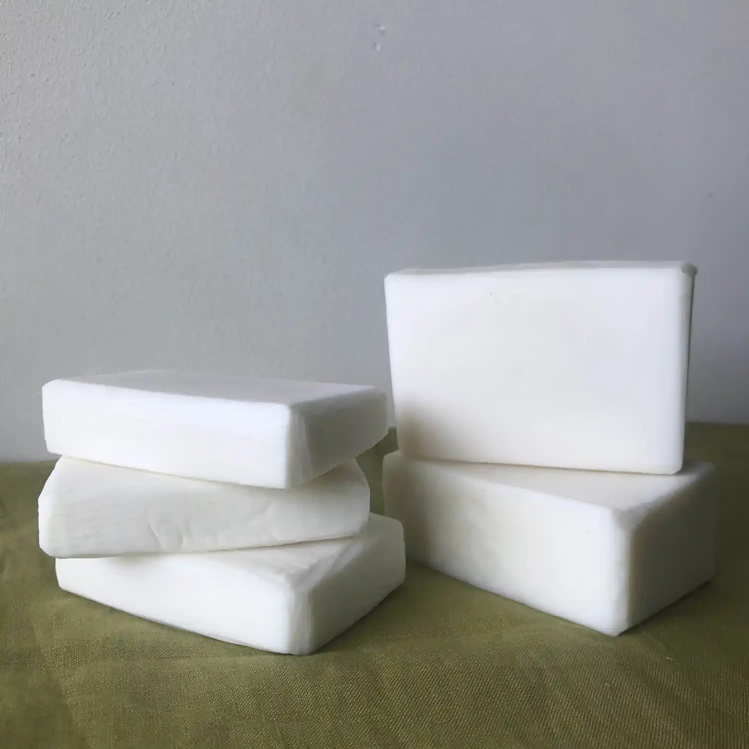 5 bars of white coloured soaps